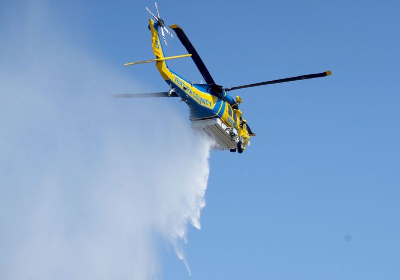 The Ventura County Fire Department’s Firehawk performs a water drop and lands on the south lawn of the Ronald Reagan Presidential Library & Museum in Simi Valley June 25, 2025. The helicopter demonstration was part of Wildfire Safety Day.