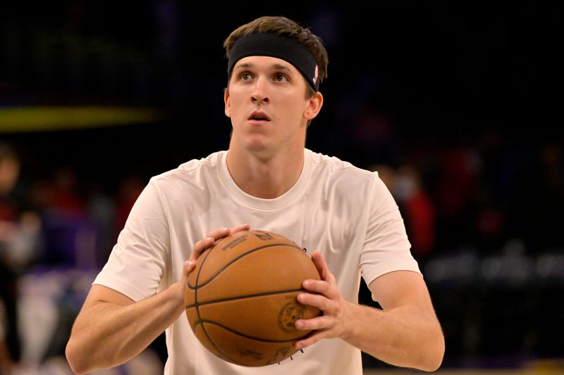 Jan 2, 2025; Los Angeles, California, USA; Los Angeles Lakers guard Austin Reaves (15) warms up prior to the game against the Portland Trail Blazers at Crypto.com Arena. Mandatory Credit: Jayne Kamin-Oncea-Imagn Images