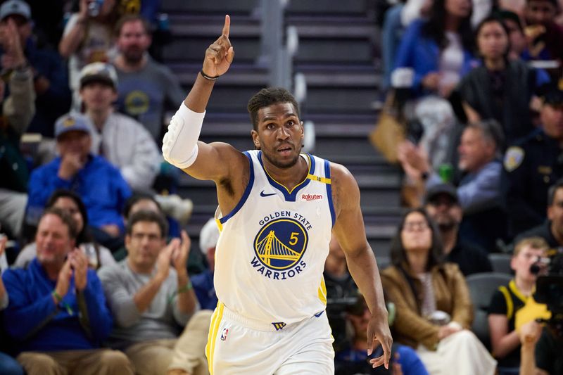 Apr 13, 2025; San Francisco, California, USA; Golden State Warriors forward Kevon Looney (5) reacts after making a basket against the LA Clippers during the third quarter at Chase Center. Mandatory Credit: Robert Edwards-Imagn Images