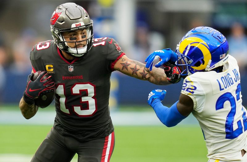 Sep 26, 2021; Inglewood, California, USA; Tampa Bay Buccaneers wide receiver Mike Evans (13) tries to run past Los Angeles Rams defensive back David Long (22) during the third quarter at SoFi Stadium. Mandatory Credit: Robert Hanashiro-USA TODAY Sports