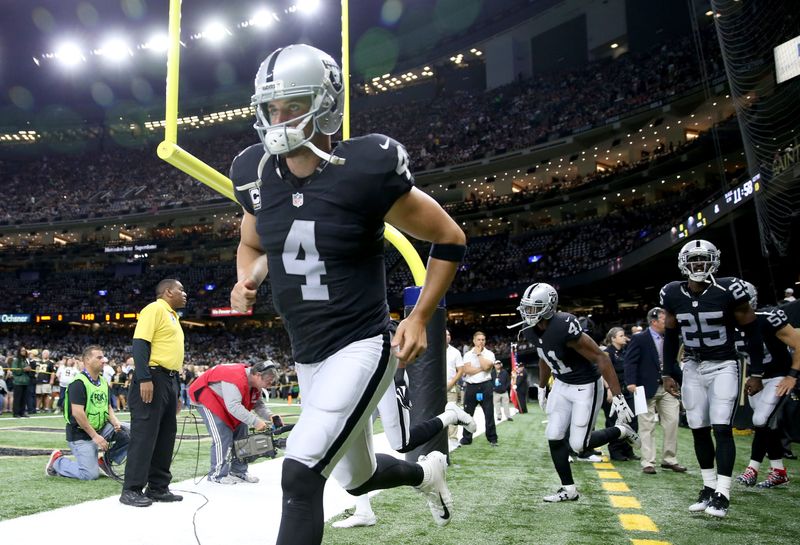 Sep 11, 2016; New Orleans, LA, USA; Oakland Raiders quarterback Derek Carr (4) runs onto the field before their game against the New Orleans Saints at the Mercedes-Benz Superdome. Mandatory Credit: Chuck Cook-USA TODAY Sports