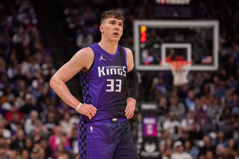 Mar 20, 2025; Sacramento, California, USA; Sacramento Kings forward Jake LaRavia (33) looks on during the fourth quarter of the game against the Chicago Bulls at Golden 1 Center. Mandatory Credit: Ed Szczepanski-Imagn Images