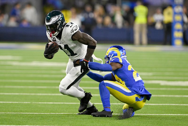 Nov 24, 2024; Inglewood, California, USA; Philadelphia Eagles wide receiver A.J. Brown (11) spins away from Los Angeles Rams cornerback Darious Williams (24) after a catch-and-run during the first half at SoFi Stadium. Mandatory Credit: Alex Gallardo-Imagn Images
