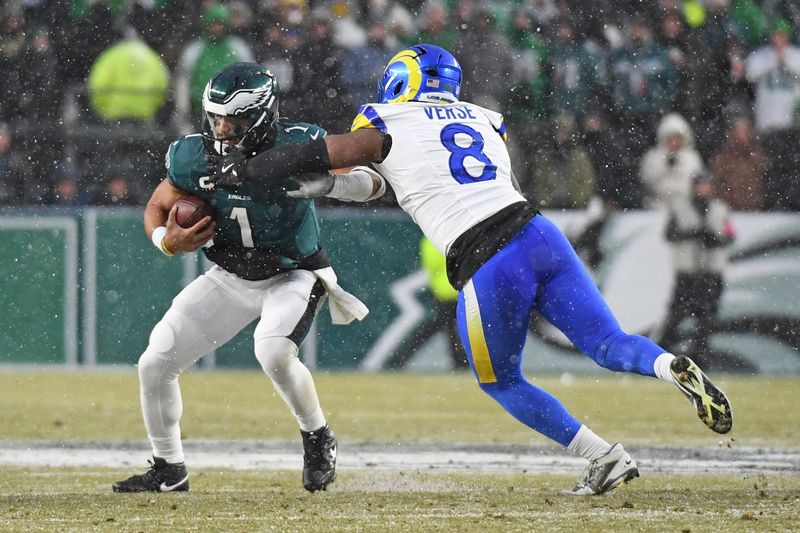 Jan 19, 2025; Philadelphia, Pennsylvania, USA;Los Angeles Rams linebacker Jared Verse (8) sacks Philadelphia Eagles quarterback Jalen Hurts (1) in a 2025 NFC divisional round game at Lincoln Financial Field. Mandatory Credit: Eric Hartline-Imagn Images