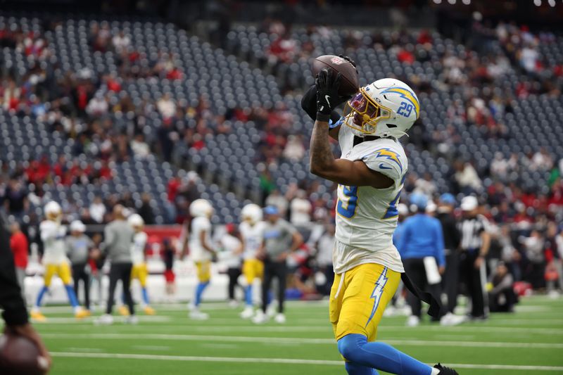 Jan 11, 2025; Houston, Texas, USA; Los Angeles Chargers corner back Tarheeb Still (29) warms up prior to the game against Houston Texans in an AFC wild card game at NRG Stadium. Mandatory Credit: Thomas Shea-Imagn Images
