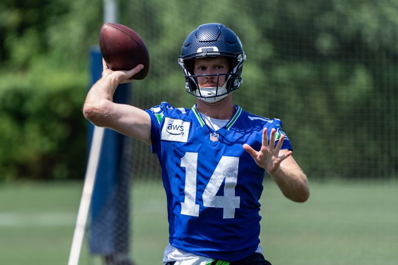 Jun 11, 2025; Renton, WA, USA; Seattle Seahawks quarterback Sam Darnold (14) passes the ball during mini-camp at Virginia Mason Athletic Center. Mandatory Credit: Stephen Brashear-Imagn Images