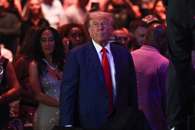 Jun 7, 2025; Newark, New Jersey, UNITED STATES; The President of the United States Donald Trump in attendance before the Gastelum versus Pyfer fight during UFC 316 at Prudential Center. Mandatory Credit: Vincent Carchietta-Imagn Images