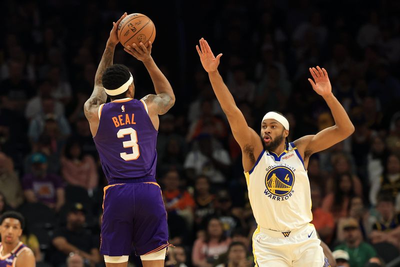 Apr 8, 2025; Phoenix, Arizona, USA; Phoenix Suns guard Bradley Beal (3) shoots the bal against Golden State Warriors guard Moses Moody (4) during the first half at Footprint Center. Mandatory Credit: Mark J. Rebilas-Imagn Images