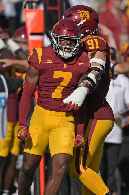 Oct 12, 2024; Los Angeles, California, USA; USC Trojans safety Kamari Ramsey (7) reacts after a play in the second half against the Penn State Nittany Lions at United Airlines Field at Los Angeles Memorial Coliseum. Mandatory Credit: Jayne Kamin-Oncea-Imagn Images