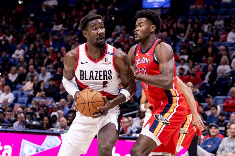 Nov 4, 2024; New Orleans, Louisiana, USA; Portland Trail Blazers center Deandre Ayton (2) dribbles against New Orleans Pelicans center Yves Missi (21) during the first half at Smoothie King Center. Mandatory Credit: Stephen Lew-Imagn Images