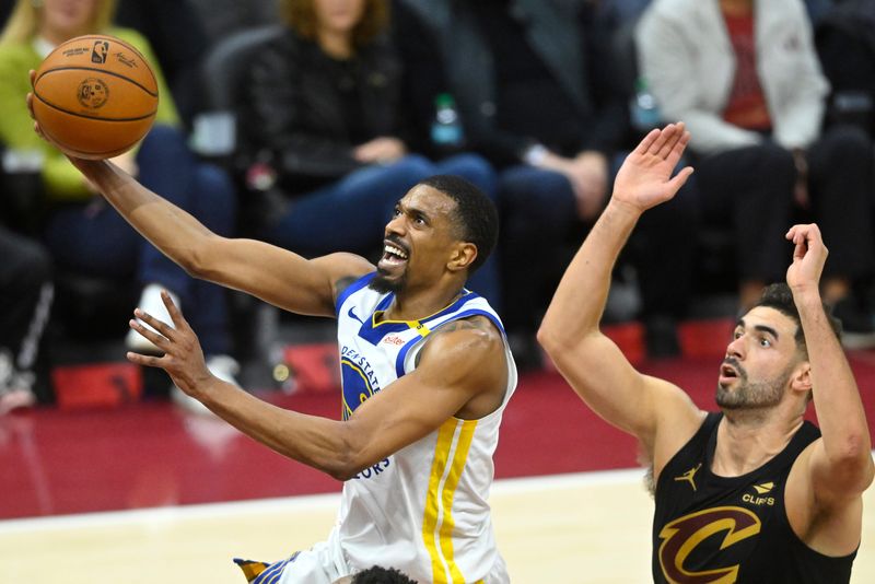 Nov 8, 2024; Cleveland, Ohio, USA; Golden State Warriors guard De'Anthony Melton (8) drives to the basket beside Cleveland Cavaliers forward Georges Niang (20) in the fourth quarter at Rocket Mortgage FieldHouse. Mandatory Credit: David Richard-Imagn Images