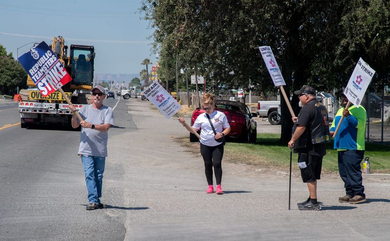 Striking workers picket the Republic Services Stockton facility at 1145 W. Charter Way in Stockton.
