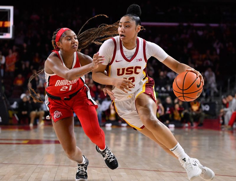 Feb 8, 2025; Los Angeles, California, USA; USC Trojans guard JuJu Watkins (12) drives to the basket as Ohio State Buckeyes guard Chance Gray (21) tries to defend during the fourth quarter at Galen Center. Mandatory Credit: Robert Hanashiro-Imagn Images