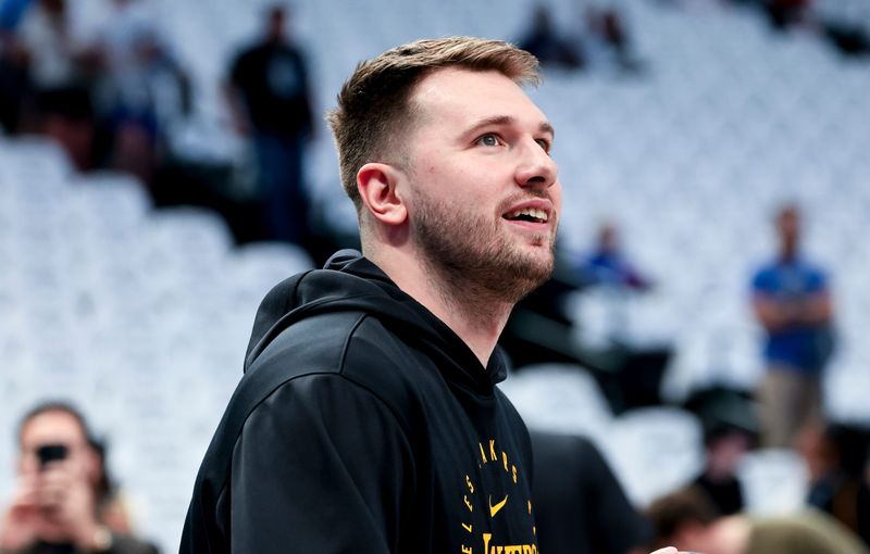 Apr 9, 2025; Dallas, Texas, USA; Los Angeles Lakers guard Luka Doncic (77) laughs before the game against the Dallas Mavericks at American Airlines Center. Mandatory Credit: Kevin Jairaj-Imagn Images