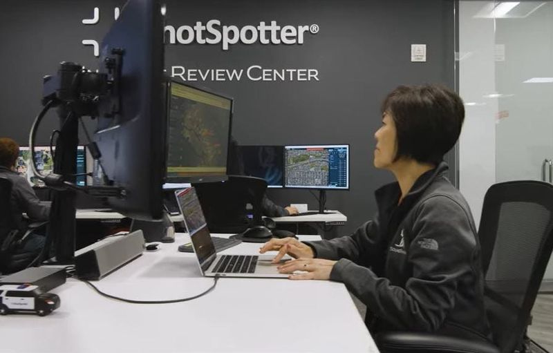 An employee is seen working in a ShotSpotter Incident Review Center in an undated photo.
