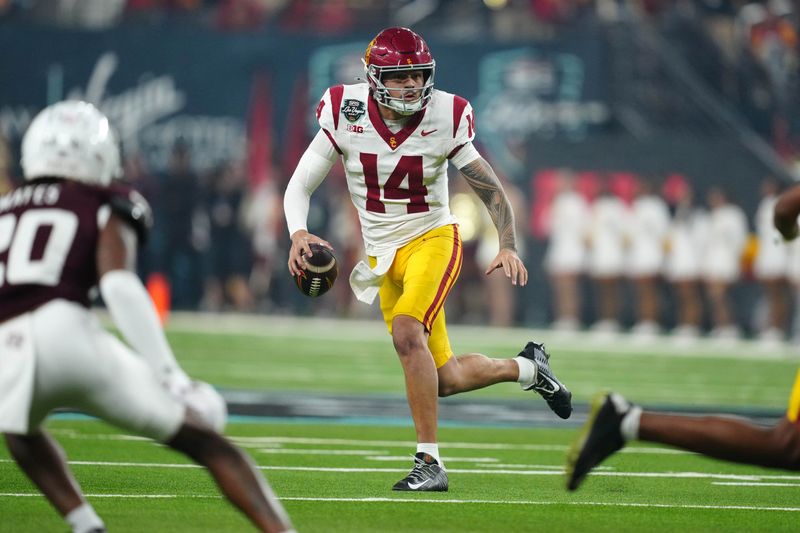 Dec 27, 2024; Las Vegas, NV, USA; Southern California Trojans quarterback Jayden Maiava (14) throws the ball against the Texas A&M Aggies in the first half at Allegiant Stadium. Mandatory Credit: Kirby Lee-Imagn Images