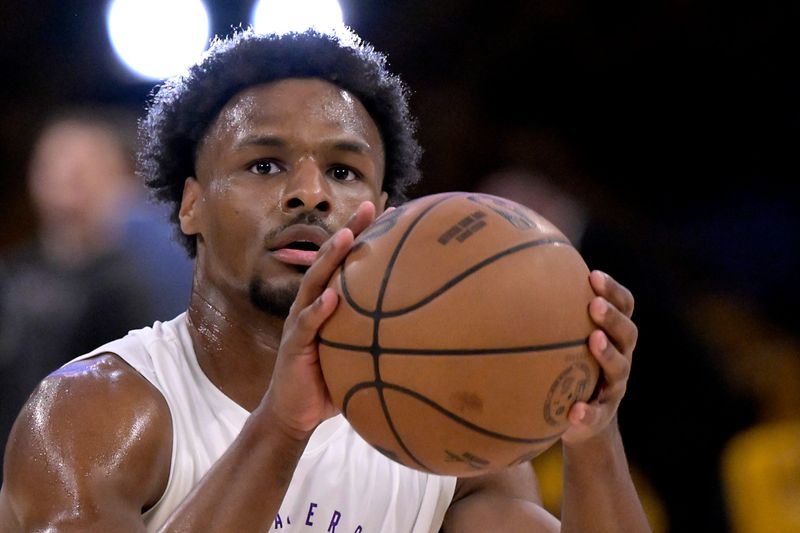 Apr 19, 2025; Los Angeles, California, USA; Los Angeles Lakers guard Bronny James (9) warms up prior to the game against the Minnesota Timberwolves at Crypto.com Arena. Mandatory Credit: Jayne Kamin-Oncea-Imagn Images