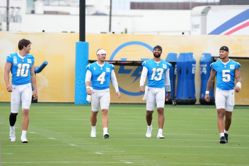 Jul 21, 2025; El Segundo, CA, USA; Los Angeles Chargers quarterbacks Justin Herbert (10), Taylor Heinicke (4), 
DJ Uiagalelei (13) and Trey Lance (5) at training camp at The Bolt. Mandatory Credit: Kirby Lee-Imagn Images