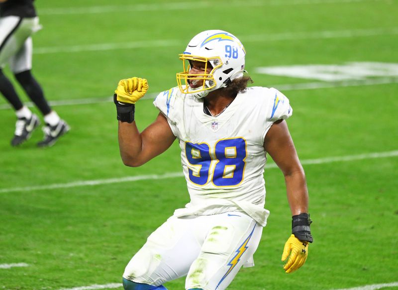 Dec 17, 2020; Paradise, Nevada, USA; Los Angeles Chargers defensive end Isaac Rochell (98) celebrates a play against the Las Vegas Raiders at Allegiant Stadium. Mandatory Credit: Mark J. Rebilas-USA TODAY Sports