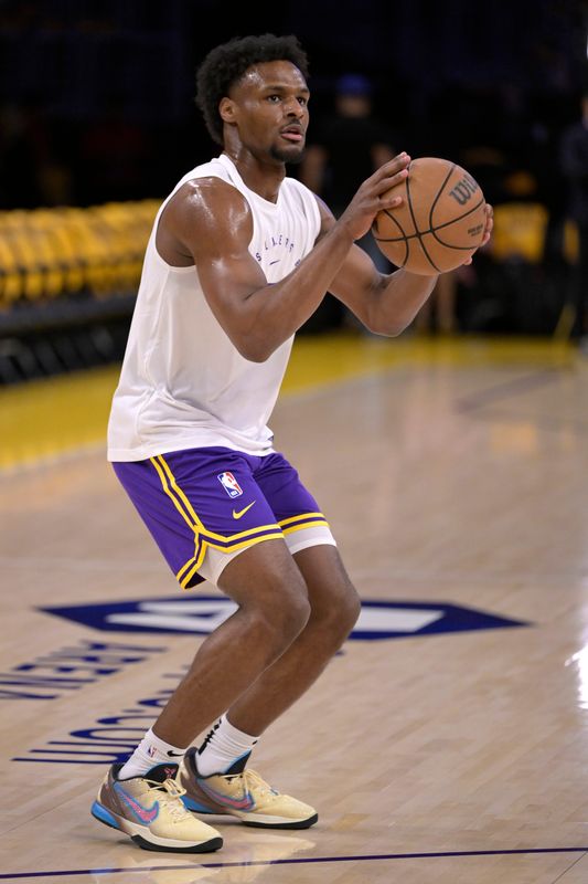 Apr 19, 2025; Los Angeles, California, USA; Los Angeles Lakers guard Bronny James (9) warms up prior to the game against the Minnesota Timberwolves at Crypto.com Arena. Mandatory Credit: Jayne Kamin-Oncea-Imagn Images