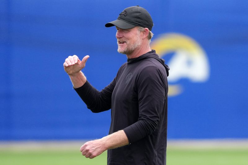 May 28, 2025; Woodland Hills, CA, USA; Los Angeles Rams general manager Les Snead reacts during organized team activities at Rams Practice Facility. Mandatory Credit: Kirby Lee-Imagn Images