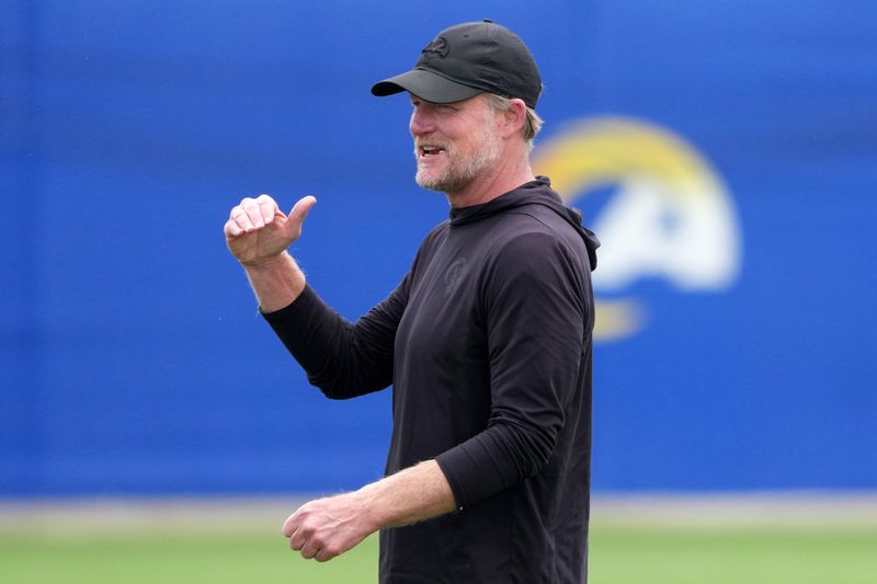 May 28, 2025; Woodland Hills, CA, USA; Los Angeles Rams general manager Les Snead reacts during organized team activities at Rams Practice Facility. Mandatory Credit: Kirby Lee-Imagn Images