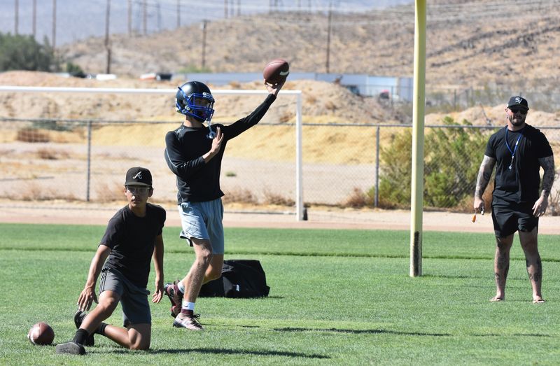 Silver Valley quarterback Casen Mogan throws a pass during a recent summer practice at the school.