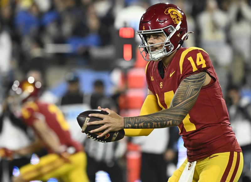 Nov 23, 2024; Pasadena, California, USA; USC Trojans quarterback Jayden Maiava (14) takes the snap during the first quarter against the UCLA Bruins at Rose Bowl. Mandatory Credit: Robert Hanashiro-Imagn Images