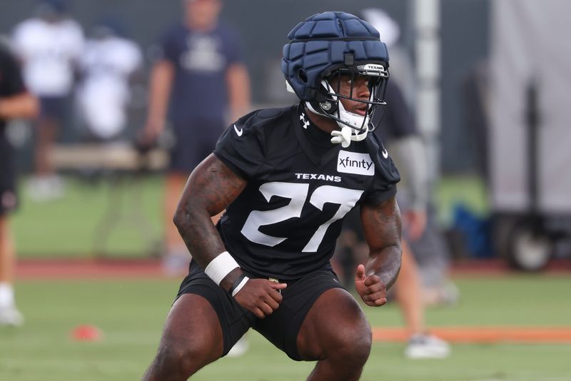 Jul 23, 2025; Houston, TX, USA; Houston Texans running back Woody Marks (27) during training camp at Houston Methodist Training Center. Mandatory Credit: Troy Taormina-Imagn Images
