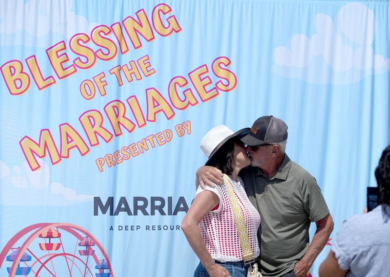 Kim and Stan Mantooth of Camarillo celebrate eight years of marriage with a kiss during the Blessing of the Marriages ceremony at the Ventura County Fair on Aug. 5.