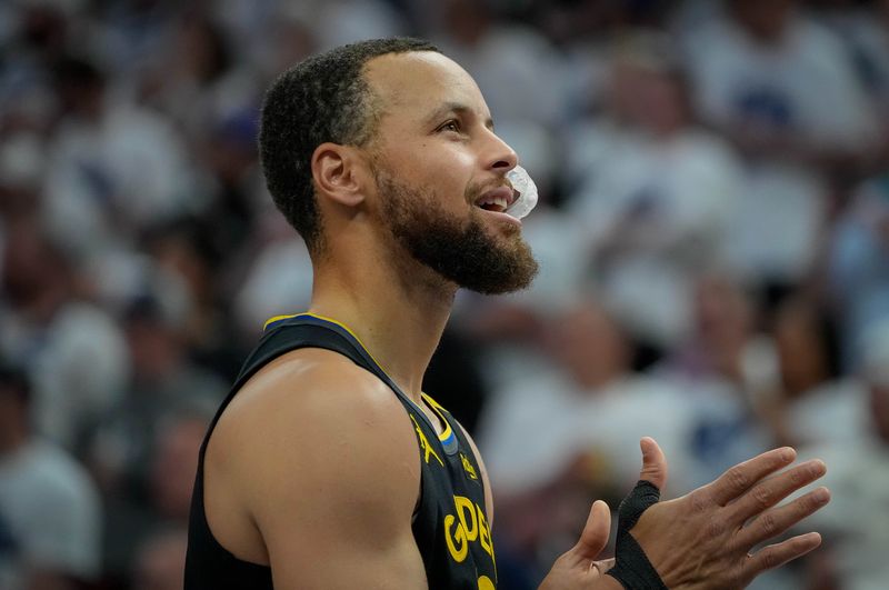 May 6, 2025; Minneapolis, Minnesota, USA; Golden State Warriors guard Stephen Curry (30) prepares to play the Minnesota Timberwolves before game one of the second round for the 2025 NBA Playoffs at Target Center. Mandatory Credit: Bruce Kluckhohn-Imagn Images