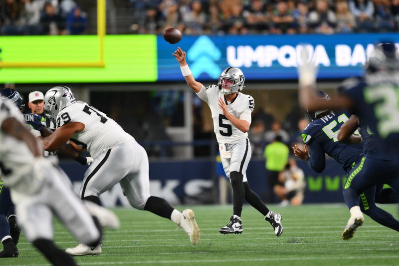 Aug 7, 2025; Seattle, Washington, USA; Las Vegas Raiders quarterback Cam Miller (5) passes the ball against the Seattle Seahawks during the second half at Lumen Field. Mandatory Credit: Steven Bisig-Imagn Images