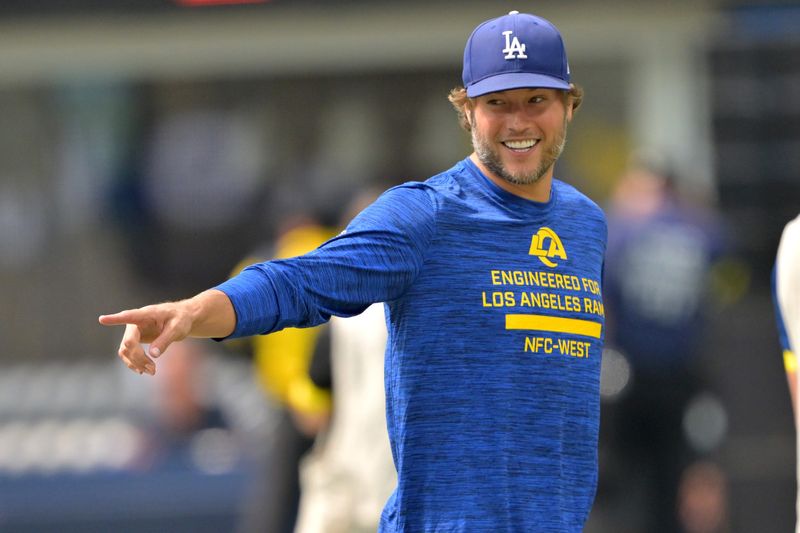 Aug 9, 2025; Inglewood, California, USA; Los Angeles Rams quarterback Matthew Stafford (9) walks on the field prior to the game against the Dallas Cowboys at SoFi Stadium. Mandatory Credit: Jayne Kamin-Oncea-Imagn Images