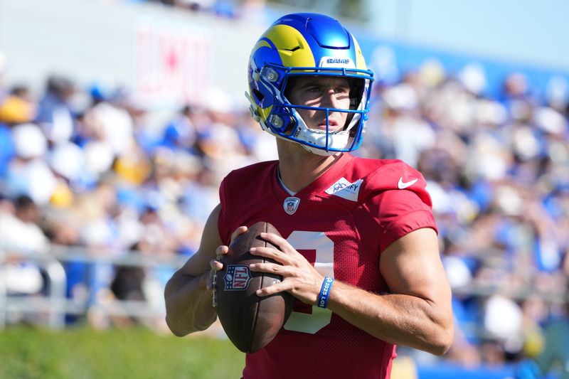 Jul 23, 2025; Los Angeles, CA, USA; Los Angeles Rams quarterback Stetson Bennett (13) throws the ball during training camp at Loyola Marymount University. Mandatory Credit: Kirby Lee-Imagn Images