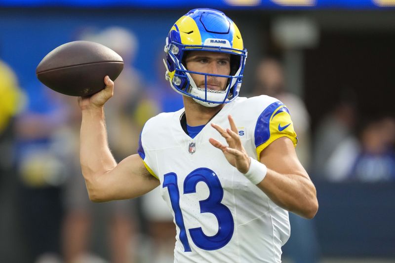 Aug 9, 2025; Inglewood, California, USA; Los Angeles Rams quarterback Stetson Bennett IV (13) throws the ball against the Dallas Cowboys in the first half at SoFi Stadium. Mandatory Credit: Kirby Lee-Imagn Images