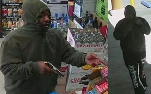 A gunman robs a Hesperia liquor store on Thursday, Aug. 7, 2025, as pictured in this surveillance camera image.