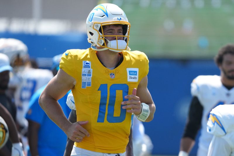 Aug 7, 2025; El Segundo, CA, USA; Los Angeles Chargers quarterback Justin Herbert (10) reacts during training camp at The Bolt. Mandatory Credit: Kirby Lee-Imagn Images