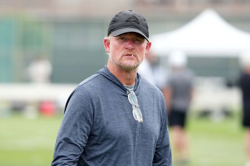 Aug 14, 2025; Carson, CA, USA; Los Angeles Rams general manager Les Snead watches during a joint practice against the New Orleans Saints at the Dignity Health Sports Park. Mandatory Credit: Kirby Lee-Imagn Images