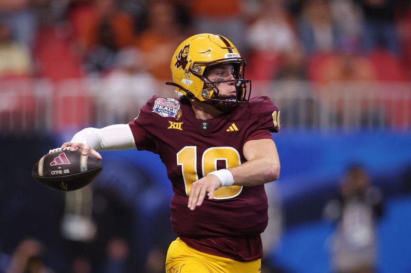 Jan 1, 2025; Atlanta, GA, USA; Arizona State Sun Devils quarterback Sam Leavitt (10) passes the ball against the Texas Longhorns during the first half of the Peach Bowl at Mercedes-Benz Stadium. Mandatory Credit: Brett Davis-Imagn Images