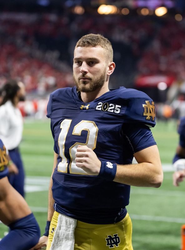 Jan 20, 2025; Atlanta, GA, USA; Notre Dame Fighting Irish quarterback CJ Carr (12) against the Ohio State Buckeyes during the CFP National Championship college football game at Mercedes-Benz Stadium. Mandatory Credit: Mark J. Rebilas-Imagn Images