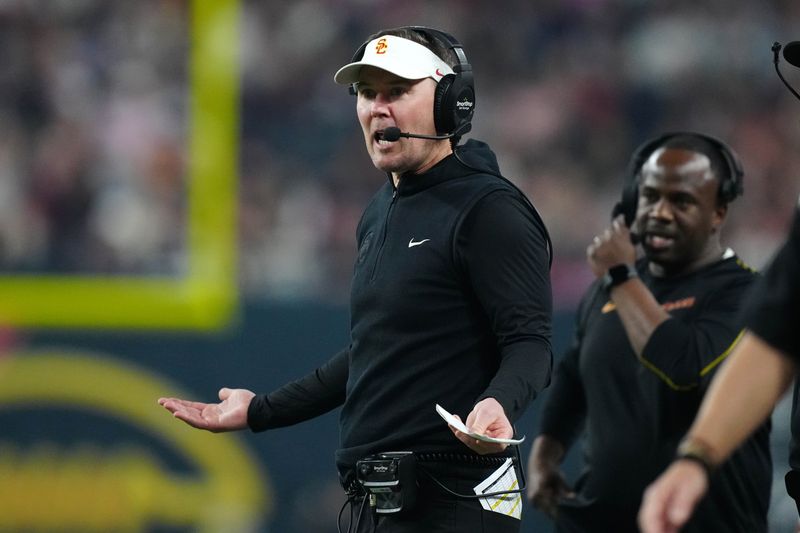 Dec 27, 2024; Las Vegas, NV, USA; Southern California Trojans head coach Lincoln Riley reacts against the Texas A&M Aggies in the first half at Allegiant Stadium. Mandatory Credit: Kirby Lee-Imagn Images