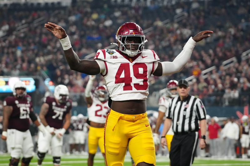 Dec 27, 2024; Las Vegas, NV, USA; Southern California Trojans defensive end Kameryn Fountain (49) celebrates against the Texas A&M Aggies in the first half at Allegiant Stadium. Mandatory Credit: Kirby Lee-Imagn Images