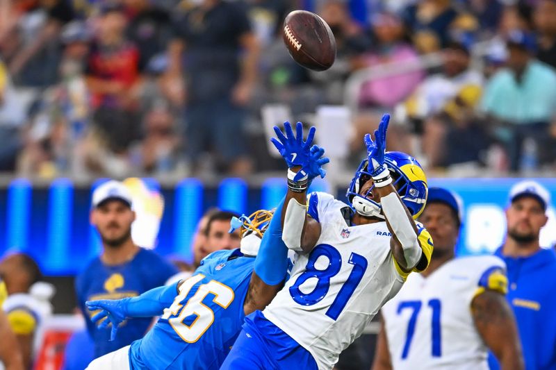 Aug 16, 2025; Inglewood, California, USA; Los Angeles Rams wide receiver Brennan Presley (81) attempts a catch against Los Angeles Chargers cornerback Nikko Reed (46) during the fourth quarter at SoFi Stadium. Mandatory Credit: Jonathan Hui-Imagn Images