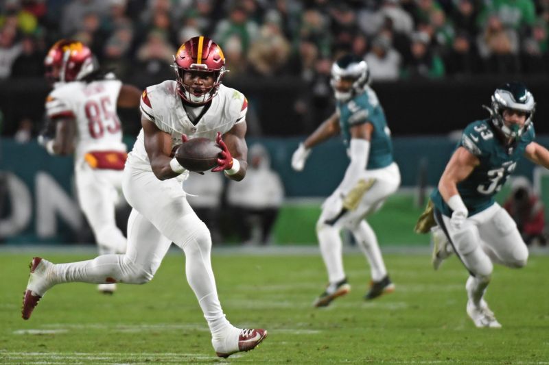Nov 14, 2024; Philadelphia, Pennsylvania, USA; Washington Commanders running back Brian Robinson Jr. (8) makes a catch against the Philadelphia Eagles during the second quarter at Lincoln Financial Field. Mandatory Credit: Eric Hartline-Imagn Images