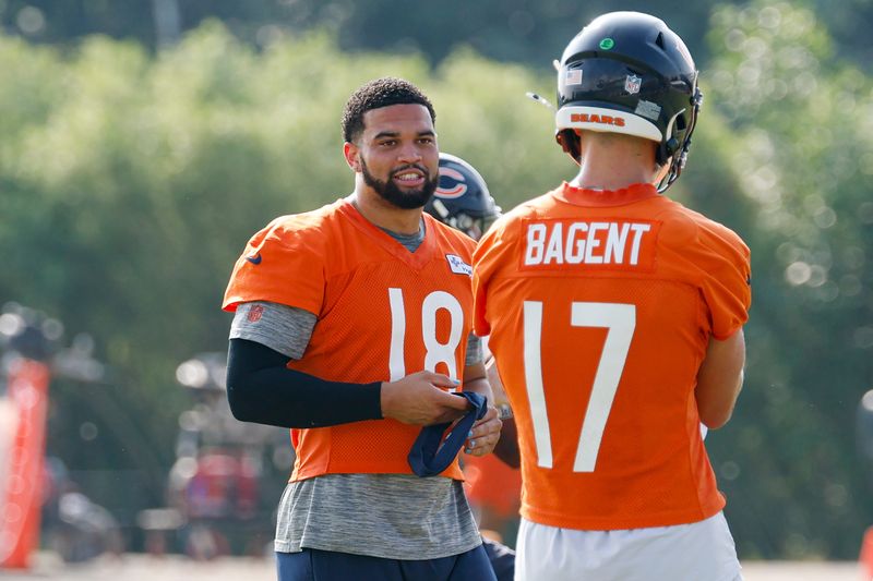 Jul 23, 2025; Lake Forest, IL, USA; Chicago Bears quarterback Caleb Williams (18) chats with quarterback Tyson Bagent (17) during training camp at Halas Hall. Mandatory Credit: Kamil Krzaczynski-Imagn Images