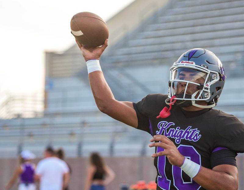 Shadow Hills quarterback Jesse Rodriguez warms up with a passing drill before their game at Shadow Hills High School in Indio, Calif., Friday, Aug. 22, 2025.