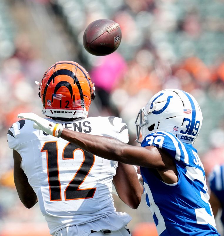 Indianapolis Colts cornerback Alex Johnson (39) moves in to tackle Cincinnati Bengals wide receiver Rashod Owens (12) as he reaches for the ball Saturday, Aug. 23, 2025, during a game against the Cincinnati Bengals at Paycor Stadium in Cincinnati. The pass fell incomplete.