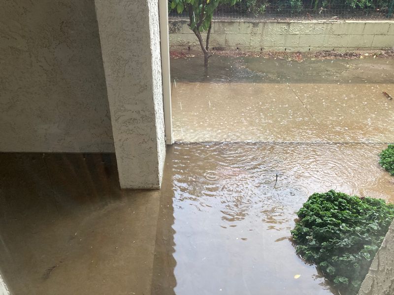 Flooding is seen in front of an apartment complex in south Palm Springs on Monday, Aug. 25, 2025.