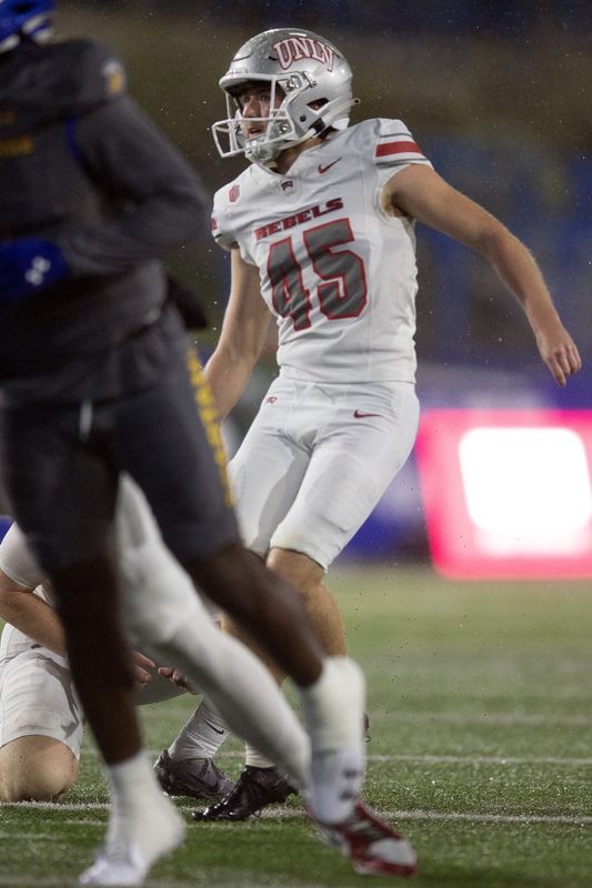 Nov 22, 2024; San Jose, California, USA; UNLV Rebels kicker Caden Chittenden (45) follows the flight of his field goal against the San Jose State Spartans during the first quarter at CEFCU Stadium. Mandatory Credit: D. Ross Cameron-Imagn Images