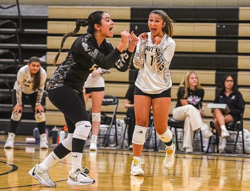 Xavier Prep's Lyla Barkett (11) and Arianna Padilla celebrate a point during their match at Xavier College Preparatory High School in Palm Desert, Calif., Tuesday, Aug. 26, 2025.